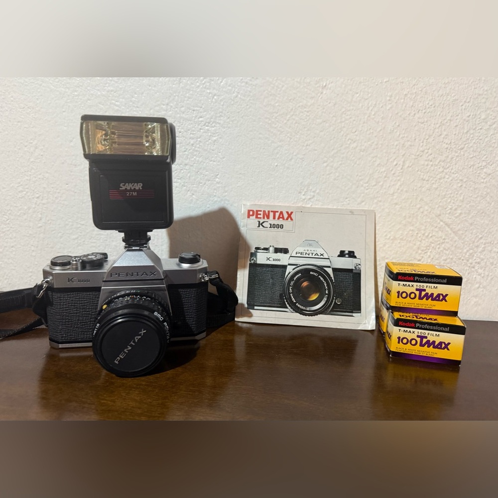 A PENTAX (K 1000) CAMERA.